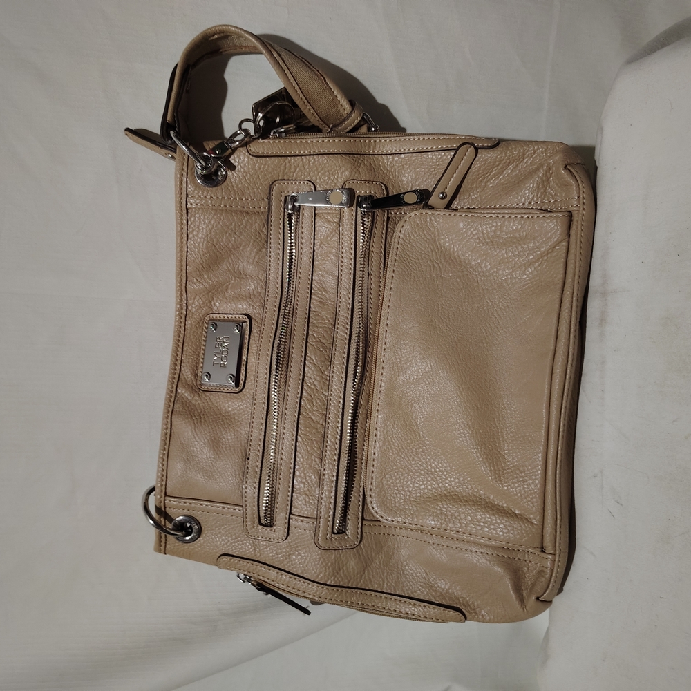 Tyler Rodan beige purse with silver accents, adjustable shoulder strap